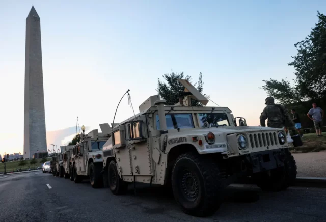 Original Photo from the Guardian US of Armoured Vehicles parked under George Washington’s Memorial. August 17, 2025
