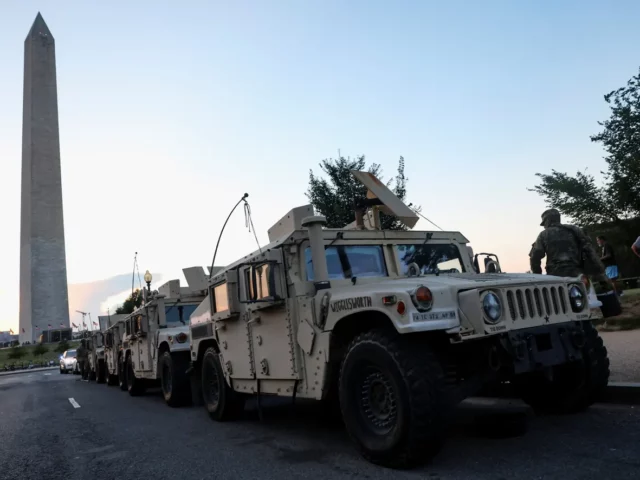 Original Photo from the Guardian US of Armoured Vehicles parked under George Washington’s Memorial. August 17, 2025